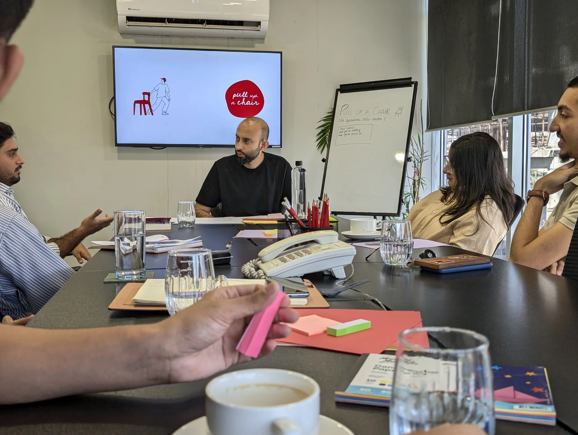 Shah Talha leading a Pull Up A Chair founder discussion