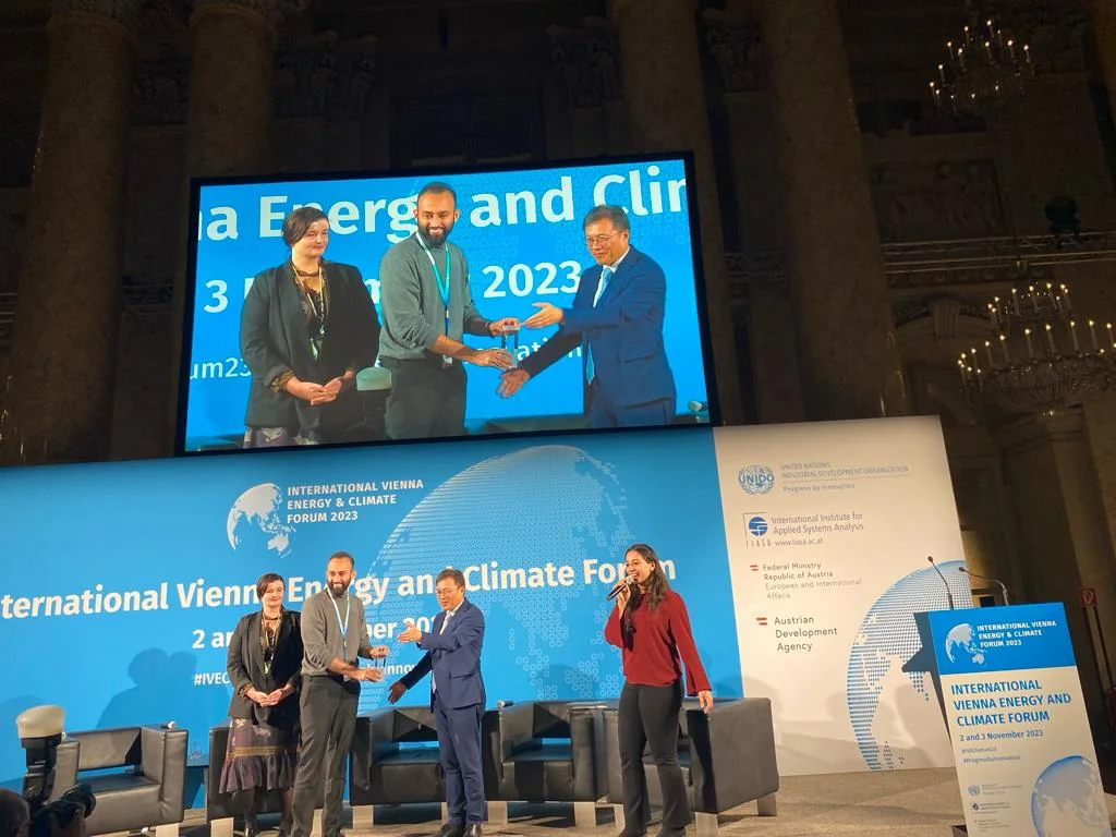 Shah Talha receiving the award at the International Vienna Energy and Climate Forum